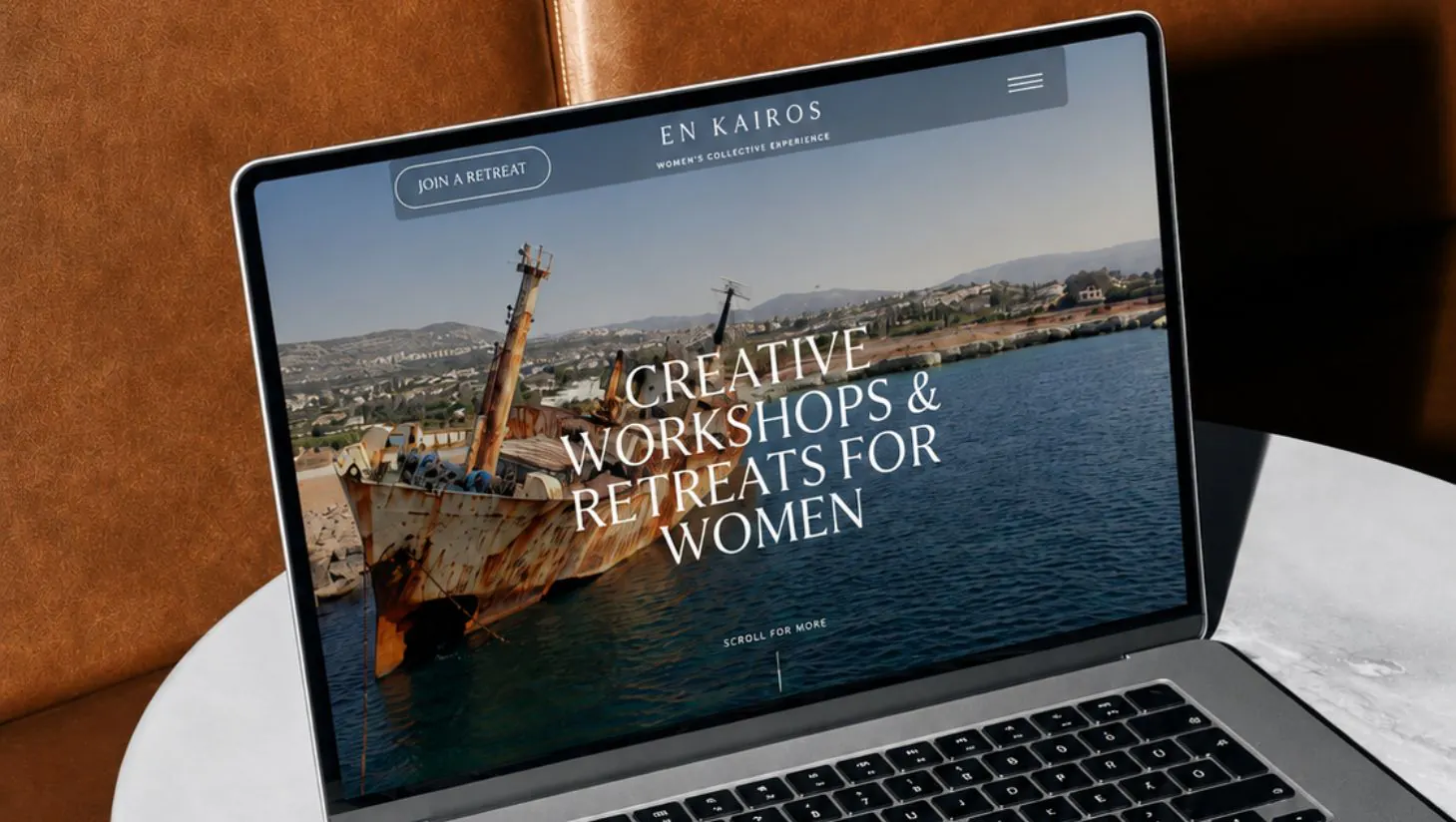 Website design by The Social Bay shown on a laptop screen